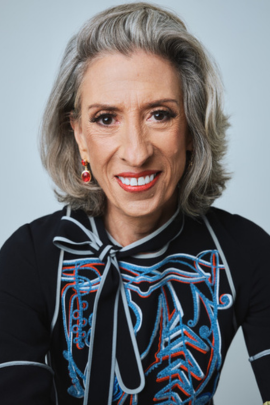 Debbie Irwin, Political Voice Actor, smiling to the camera