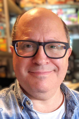 Tom Test smiling to the camera, close up picture